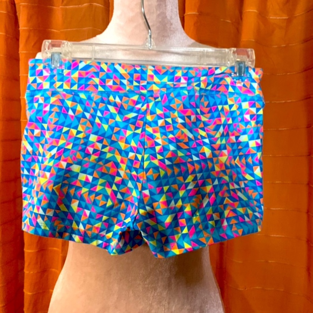 On hold Cara 🔵 RAVE- Neon geometric hot pants short shorts NWT NEW size small
